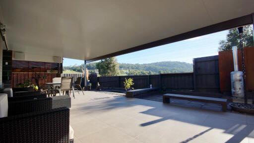 a patio with a table and chairs